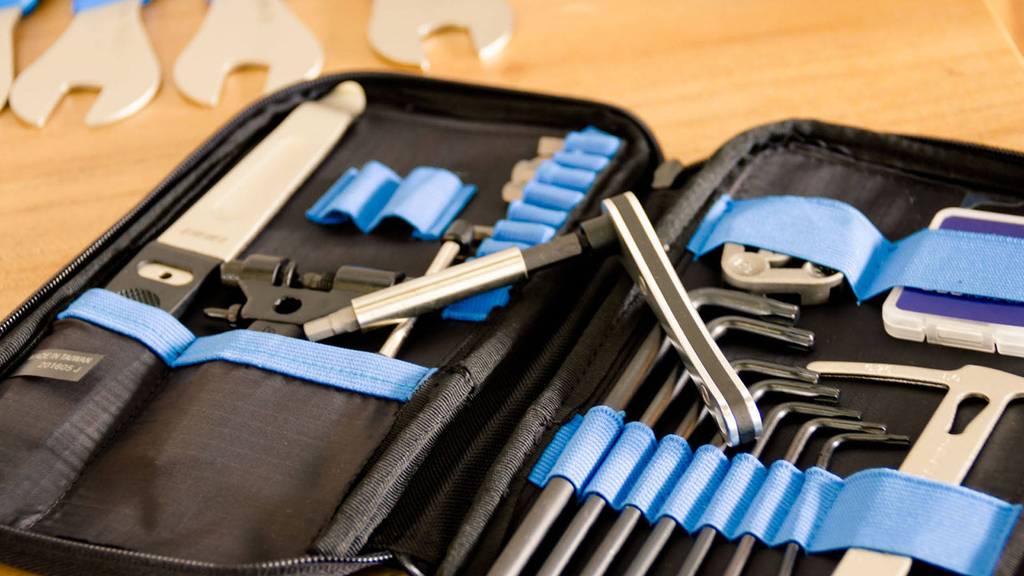 Cycling tool kit containing a tire lever, multiple torx keys, a mini rachet with multiple drivers, a spoke wrench and patch kit. BTL-117
